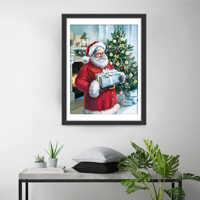 Santa Claus with a blue present Diamond Painting