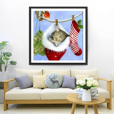 Kitty sleeping in a Christmas hat Diamond Painting