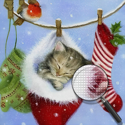 Kitty sleeping in a Christmas hat Diamond Painting